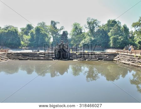 Ancient Pool. The Pool, The Shore And The Bottom Of Which Are Laid Out Of Stone Blocks. Neak Pean. K
