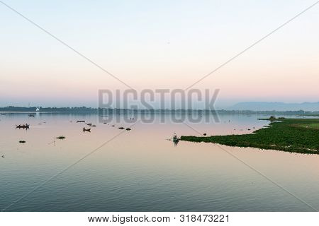 Mandalay, Myanmar - 03 December, 2018: Wide Angle Picture Of Colorful Sunset View From U Bein Bridge