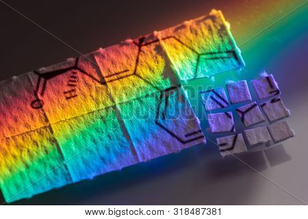 pieces of paper with chemical structures, micro dosing concept
