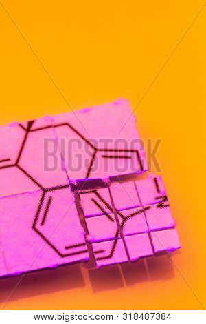 pieces of paper with chemical structures, micro dosing concept
