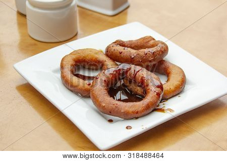 Picarones, Sweet Peruvian Sold On The Street. Traditional Peruvian Dessert Picarones