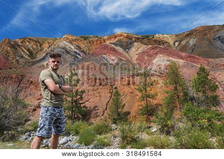 Relaxing man in Valley of Mars landscapes in the Altai Mountains, Kyzyl Chin, Siberia, Russia