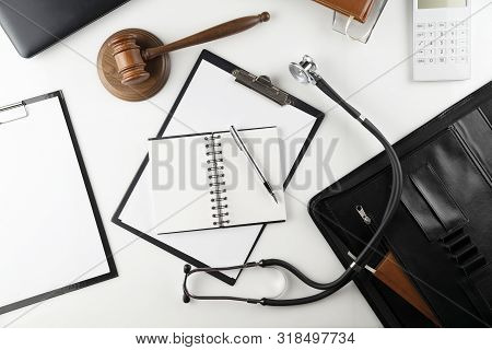Medical Law Concept.  Gavel And Stethoscope On The Wihte Table.