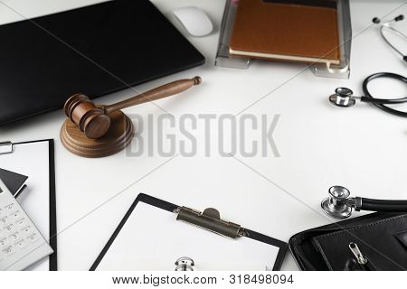 Medical Law Concept.  Gavel And Stethoscope On The Wihte Table.