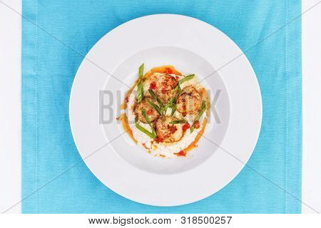 Mediterranean Fish On A Mashed Potato Pillow With Tomato Sauce