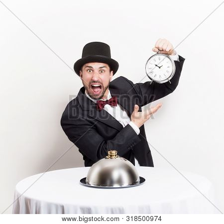 Man In Resorant With Clock. Slow Restaurant Service Concept