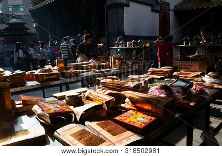 Yunlin, Taiwan - July 13th, 2019: chinese joss gold paper craft on a table at Beigang Chaotian Temple, Yunlin, Taiwan, Asia