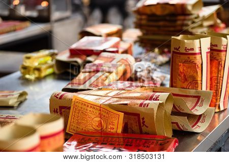 Yunlin, Taiwan - July 13th, 2019: chinese joss gold paper craft on a table at Beigang Chaotian Temple, Yunlin, Taiwan, Asia
