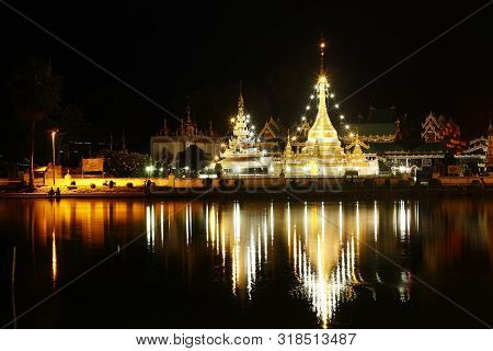 Buddhist Temple Stupa At Night Time Covered In Lights, Northern Thailand, Southeast Asia