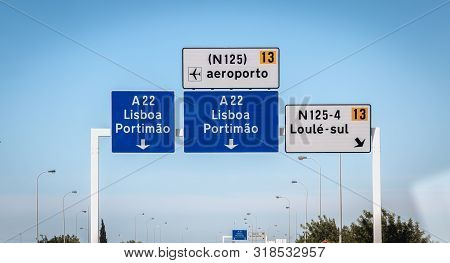 Blue Road Sign On A22 Highway Indicating The Direction Of Lisbon, Portugal