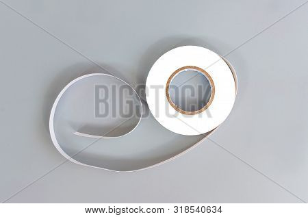 Rubber Insulator White On A Gray Background
