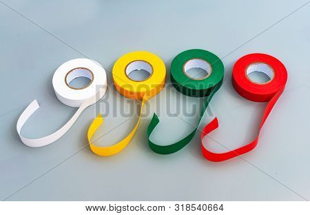 Rubber Insulating Tape Of Different Colors On A Gray Background