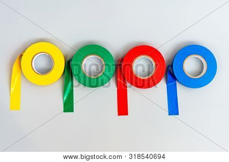 Rubber Insulating Tape Of Different Colors On A Gray Background