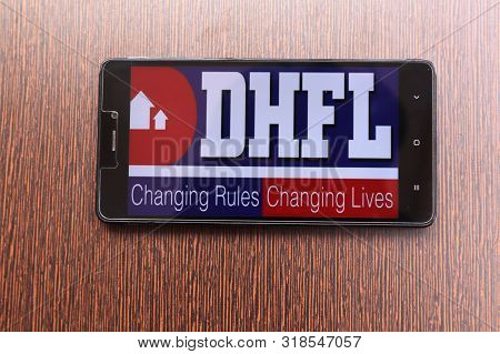 Maski India, 23 August, 2019 : Dhfl Bank Website Logo Loading On Mobile On The Table.