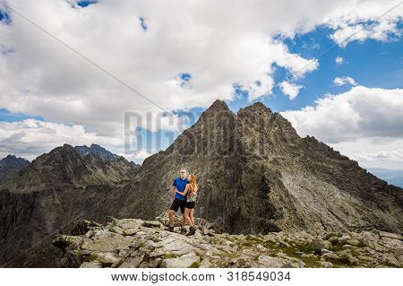 Tourists Below Rysy Tatra Mountains
