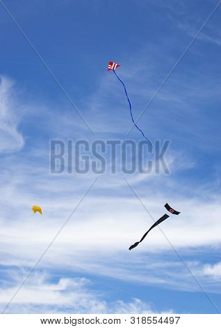 Three Kites In Blue Sky Two With Tails