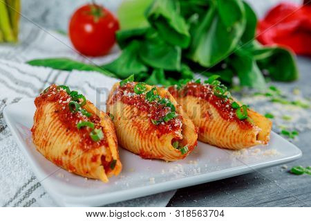 Jumbo Shells Pasta Stuffed With Ricotta Cheeses, Tomato Sauce And Chives.