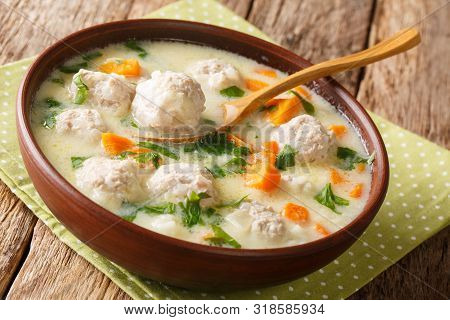 Traditional Soup With Meatballs, Yogurt And Vegetables Close-up In A Bowl. Horizontal