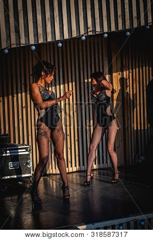 Moscow, Russia - July 27, 2019: Go Go Dance Outdoor. Two Sexy Woman At Johncalliano Hookah Fest.