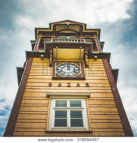 Iwonicz Zdroj, Poland - 13.08.2019: Old Town In Poland Iwonicz Zdroj. View At Old Wooden Clock Tower