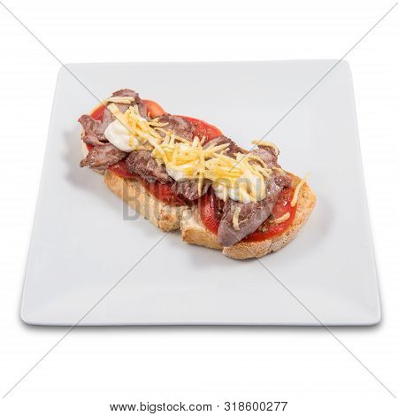 A Plate With A Toast Of Iberian Pork Sirloin On A Natural Tomato Base