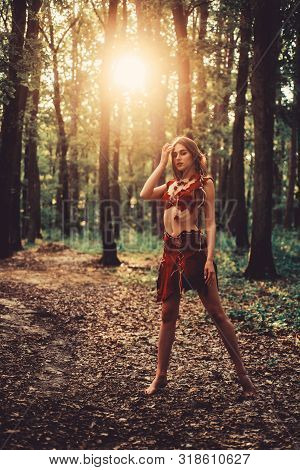 Sexy Legs. Amazon Woman. Sexy Witch. Cougar Female. Wild Woman In Forest. Sexy Girl In Leather Suede
