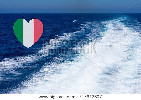 Heart Shaped Italian Flag On Background Made Of View Of Deep Blue Mediterranian Sea With Kelvou Jet,