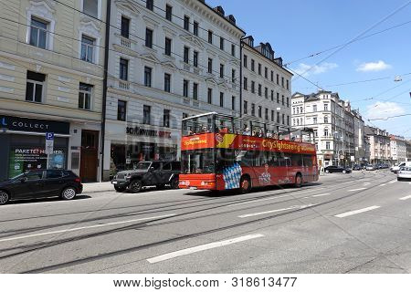 Munich. Bavaria / Germany - May The 1st,  2019: Excursion Bus With Foreign Tourists Moves On Munich 