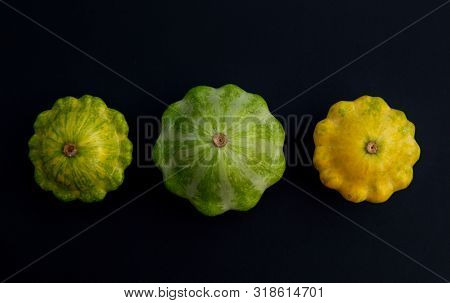 Three Pattypan Squash Vegetable. Group Of Green And Yellow Squashes, On Dark Background.