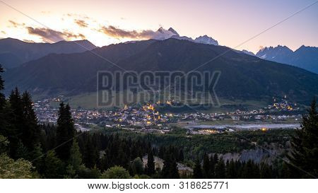Night View On Mestia With Its Beautiful Illuminated Svan Towers And High Mountains. Svaneti, Georgia