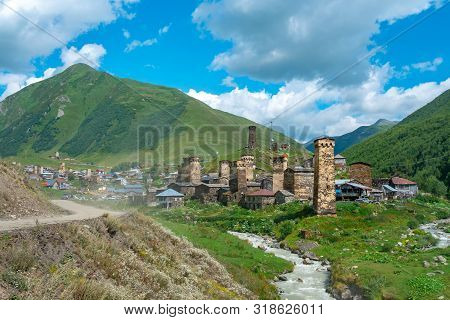 View Of The Ushguli Village At The Foot Of Mt. Shkhara. Picturesque And Gorgeous Scene. Rock Towers