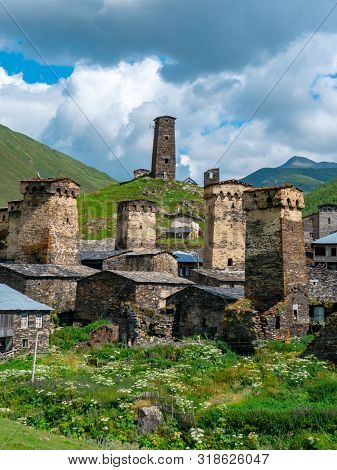 View Of The Ushguli Village At The Foot Of Mt. Shkhara. Picturesque And Gorgeous Scene. Rock Towers