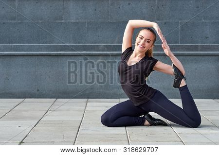 Stretching Fit Or Dancer Or Fitness Woman Doing Exercise