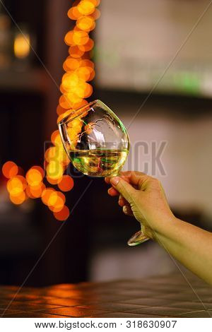 Hand Sommelier Holding Glass Of White Wine. Wine-tasting. White Wine Concept. Wine Tour. Vertical, W