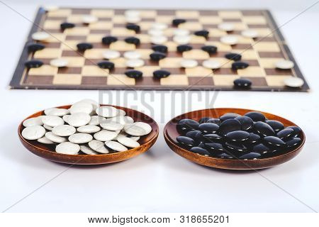 Board Game Go And Black And White Bones. Go Or Wei-chi ,asian Board Game.