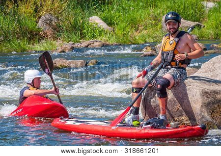 Myhiya, Ukraine - August 17, 2019: Athletes Kayakers During Training On Whitewater. Man On Inflatabl