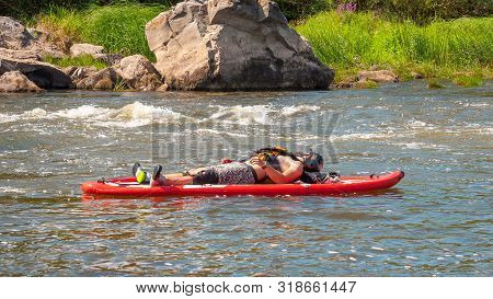 Myhiya, Ukraine - August 17, 2019: Athletes Kayakers During Training On Whitewater. Man On Inflatabl