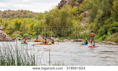 Myhiya, Ukraine - August 17, 2019: Athletes Kayakers During Training On Whitewater. Man On Inflatabl