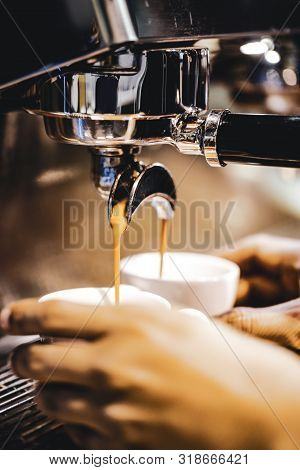 Espresso Machine Brewing A Coffee. Coffee Pouring Into Glasses In Coffee Shop, Espresso Pouring From