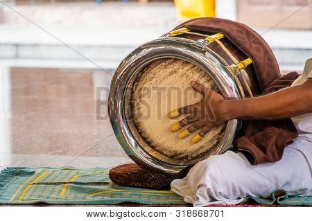 Sri Mahamariamman Temple Drum Being Played During A Puja