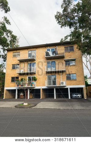 Melbourne, Australia - June 9, 2019: Brick Low-rise Apartment Building In Oshanassy Street, A Wide R