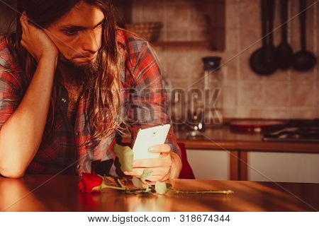 Disappointment And Depression. Unrequited Love Concept. Young Worried Disappointed Man With Single R