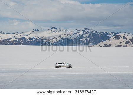 Vatnajokull Iceland - June 17. 2019: Modified 4x4 Minibus Driving With Tourists On Skalafellsjokull 
