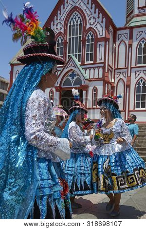Arica, Chile - February 11, 2017: Members Of A Waca Waca Dance Group In Ornate Costume Performing At