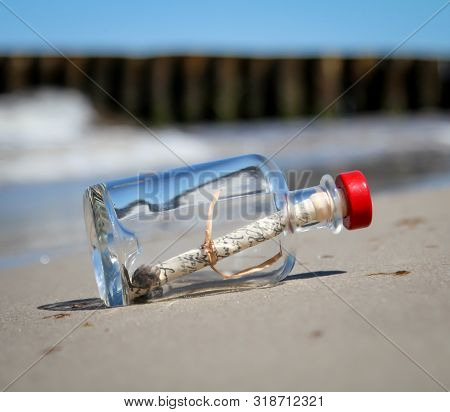 A Bottle Post On The Beach Stranded