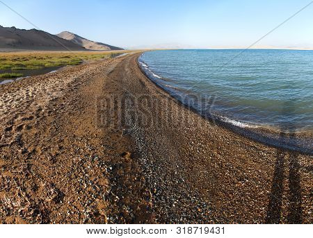 Karakul Lake And Pamir Range In Tajikistan. Landscape Around Pamir Highway M41 International Road