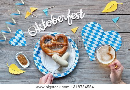 Oktoberfest, Traditional Festival Food: White Sausages, Pretzel And Beer. Flat Lay On Rustic Wooden 