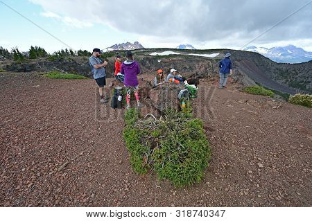 Hikers Enjoy Lunch And View At End Of Tam Mcarthur Rim Trail In Three Sisters Wilderness Near Sister