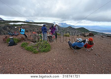 Hikers Enjoy Lunch And View At End Of Tam Mcarthur Rim Trail In Three Sisters Wilderness Near Sister