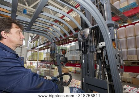 Belarus, The City Of Mensk, April 12, 2019. Chemical Production.worker On A Loader While Working